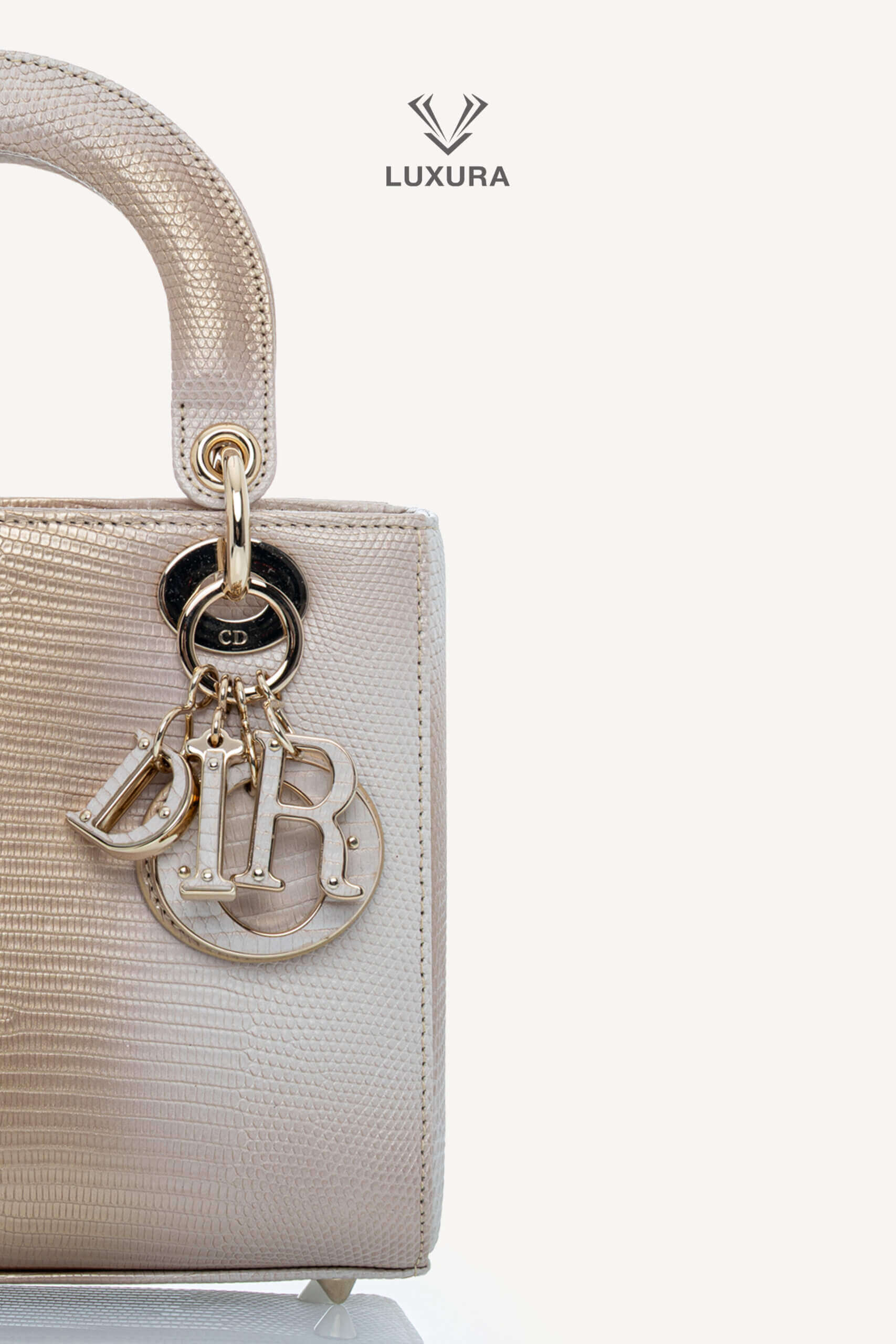 <span style="font-size: 10px;letter-spacing: .15em">HARD TO FIND</span><br>            <strong>CHRISTIAN DIOR</strong><br>            <div style="margin-top:10px;font-size:16px">Small Lady Dior Bag in Gold-Ivory Lizard Leather with Gold Hardware</div><br> - Image 7