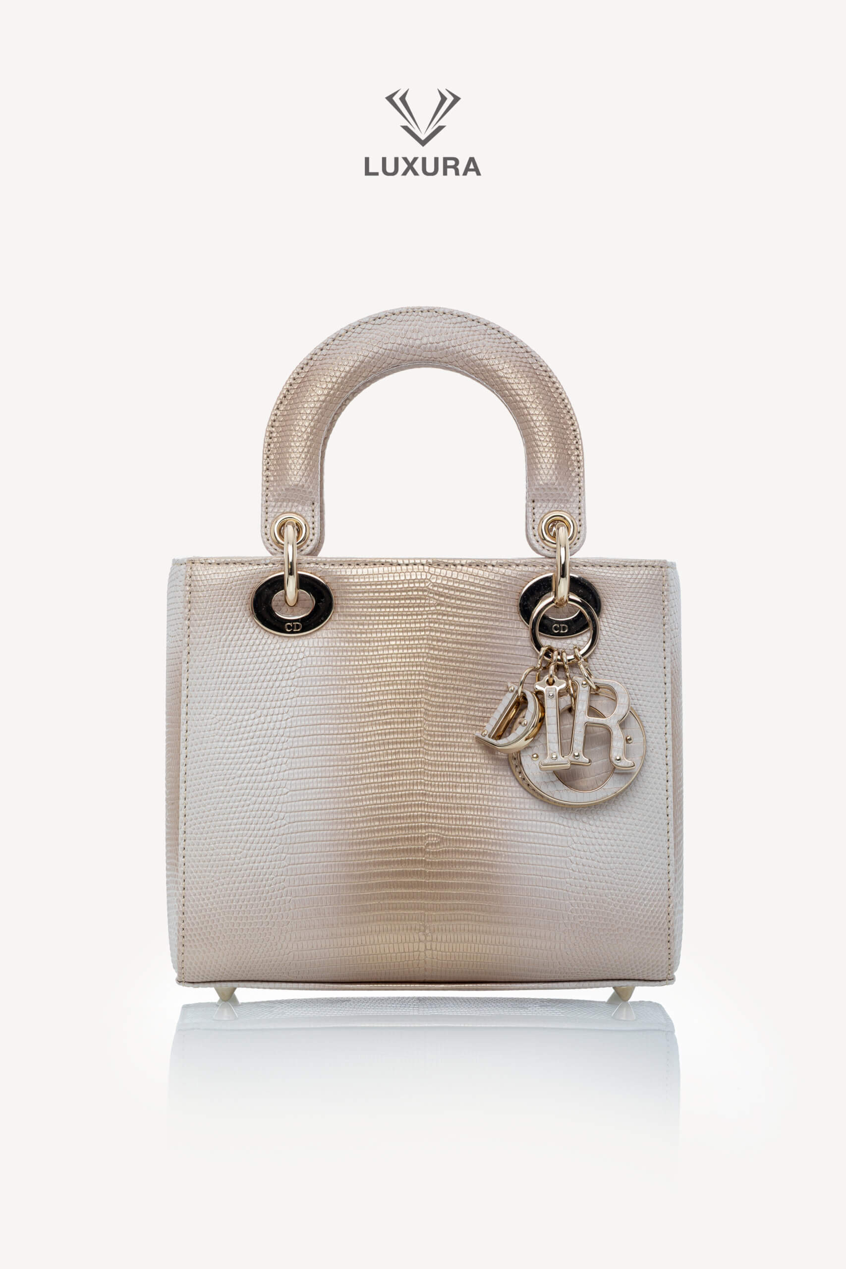 <span style="font-size: 10px;letter-spacing: .15em">HARD TO FIND</span><br>            <strong>CHRISTIAN DIOR</strong><br>            <div style="margin-top:10px;font-size:16px">Small Lady Dior Bag in Gold-Ivory Lizard Leather with Gold Hardware</div><br>