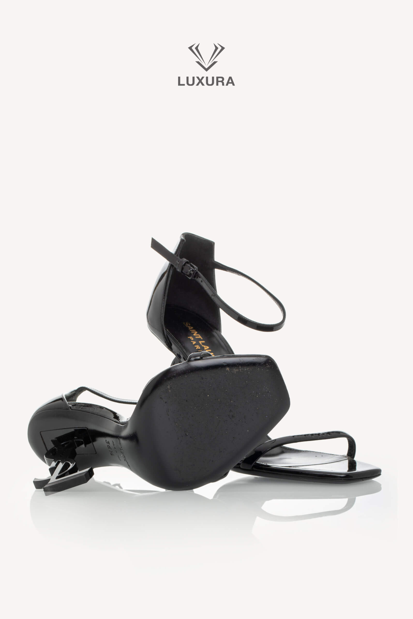 <span style="font-size: 10px;letter-spacing: .15em">BEST DEAL</span><br>            <strong>SAINT LAURENT</strong><br>            <div style="margin-top:10px;font-size:16px">Patent Calfskin Opyum 85 Sandals Black 36.5</div><br> - Image 17
