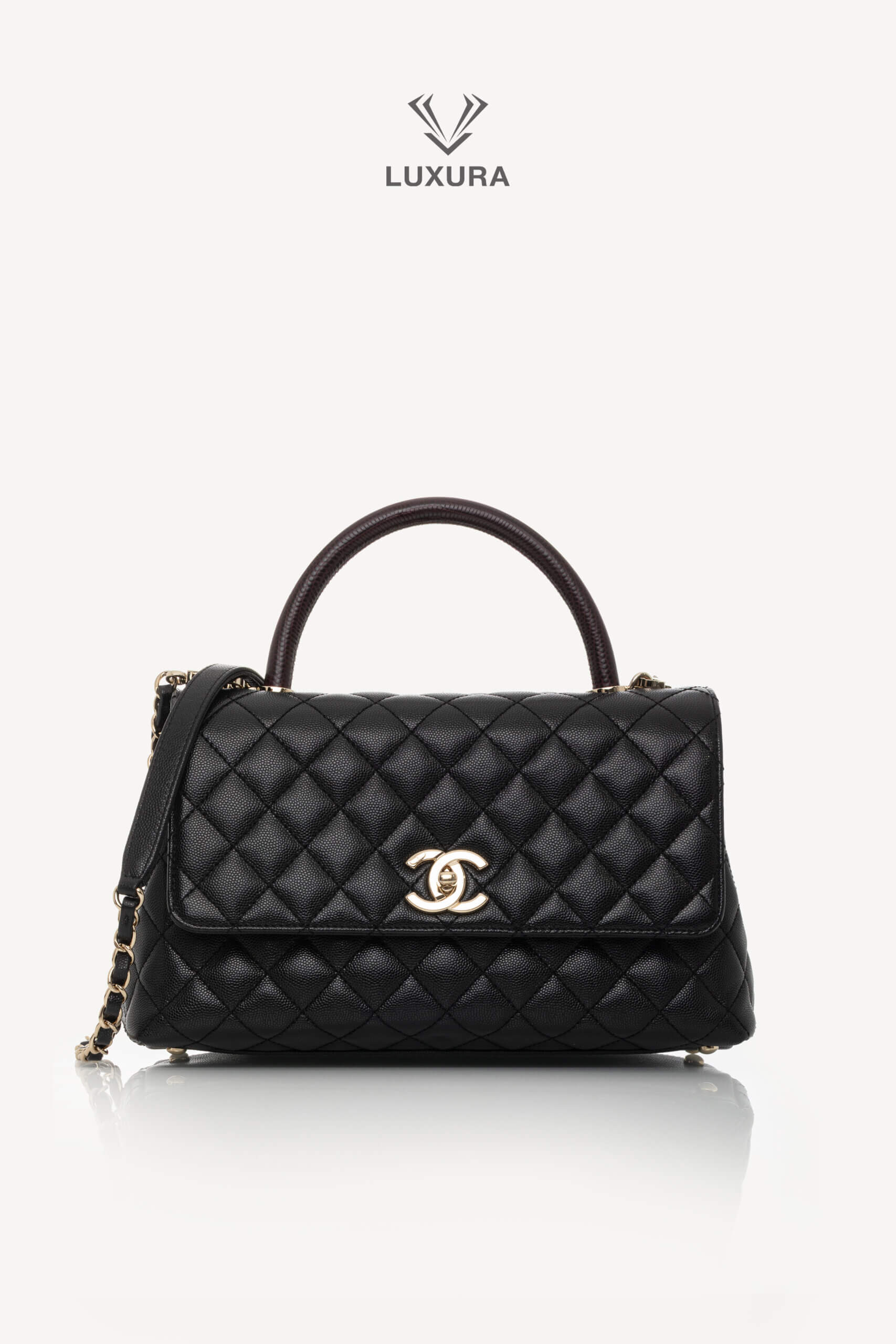 <span style="font-size: 10px;letter-spacing: .15em">HARD TO FIND</span><br>            <strong>CHANEL</strong><br>            <div style="margin-top:10px;font-size:16px">Quilted Caviar and Lizard Embossed Large Coco Top Handle Black</div><br>