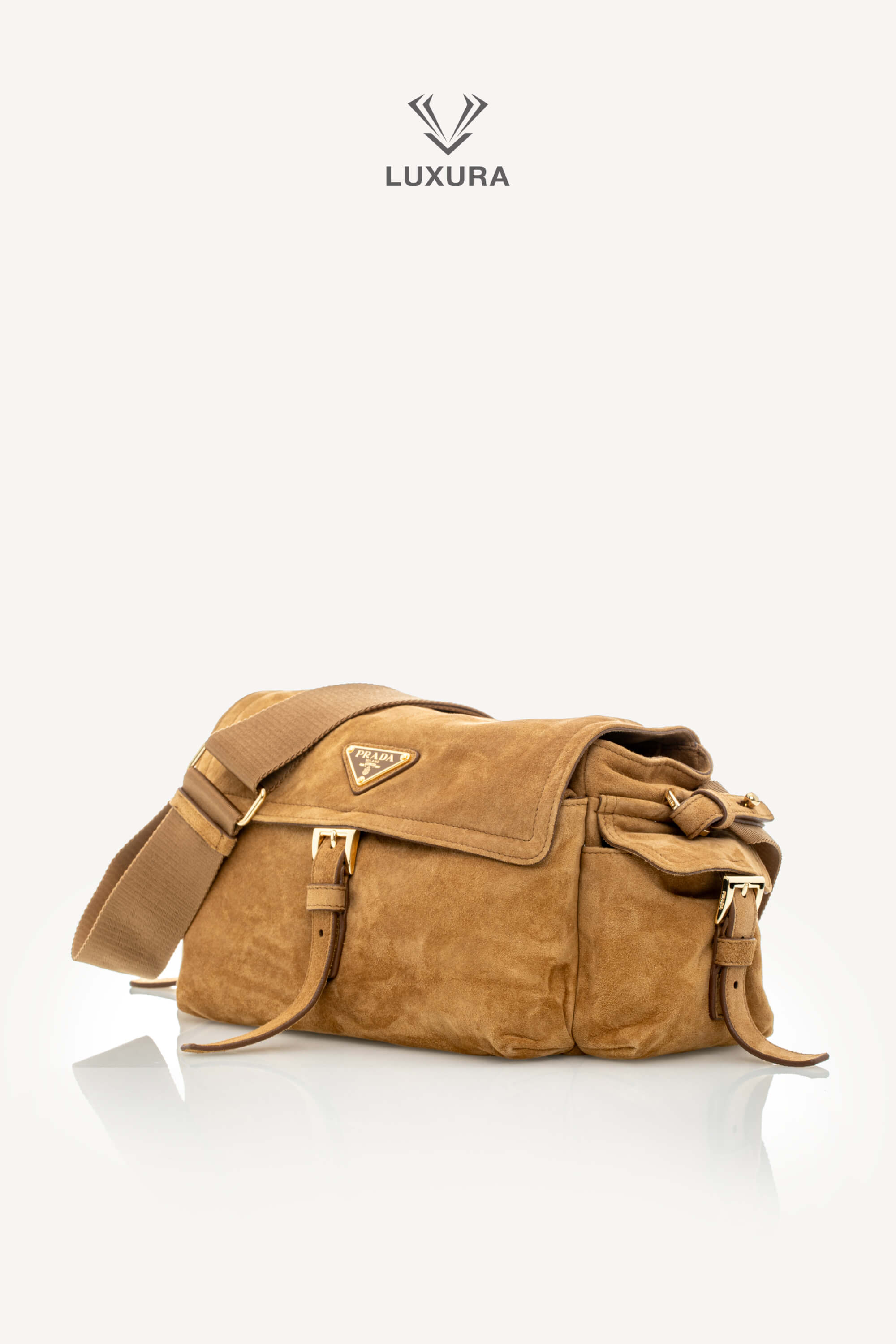<span style="font-size: 10px;letter-spacing: .15em">NEW COLLECTION</span><br> <strong>PRADA</strong><br> <div style="margin-top:10px;font-size:16px">Explore Medium Suede Leather Shoulder Bag With Flap Cinnamon</div><br> - Image 9