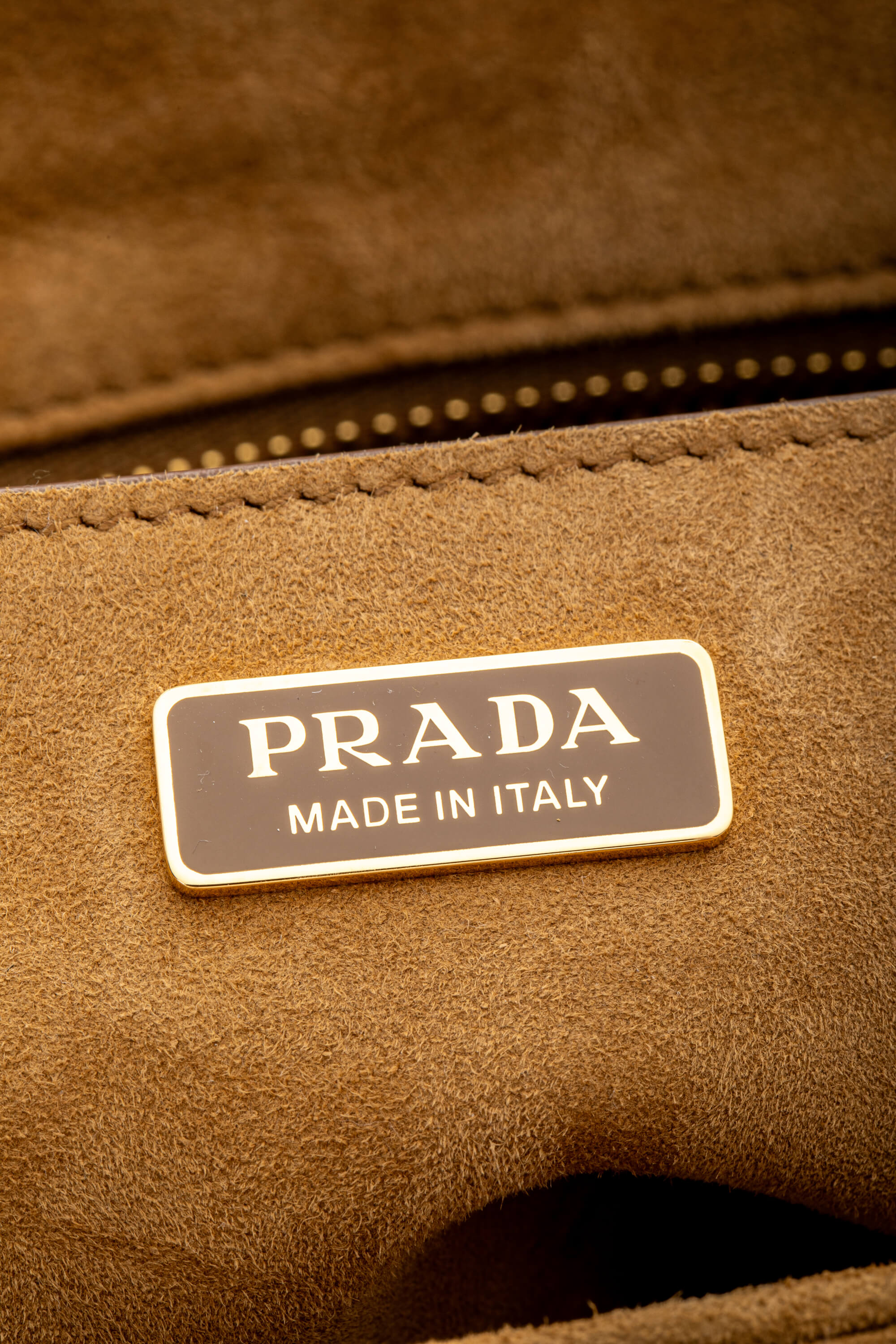 <span style="font-size: 10px;letter-spacing: .15em">NEW COLLECTION</span><br> <strong>PRADA</strong><br> <div style="margin-top:10px;font-size:16px">Explore Medium Suede Leather Shoulder Bag With Flap Cinnamon</div><br> - Image 11